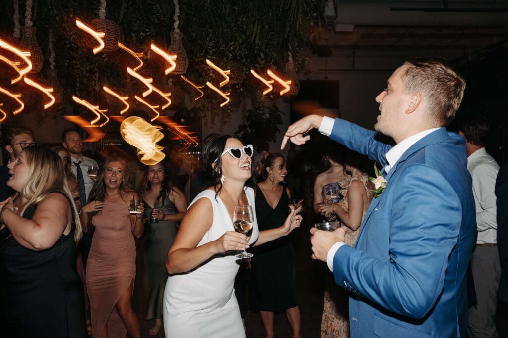 Bride and groom rock the dance floor at Urban Daisy