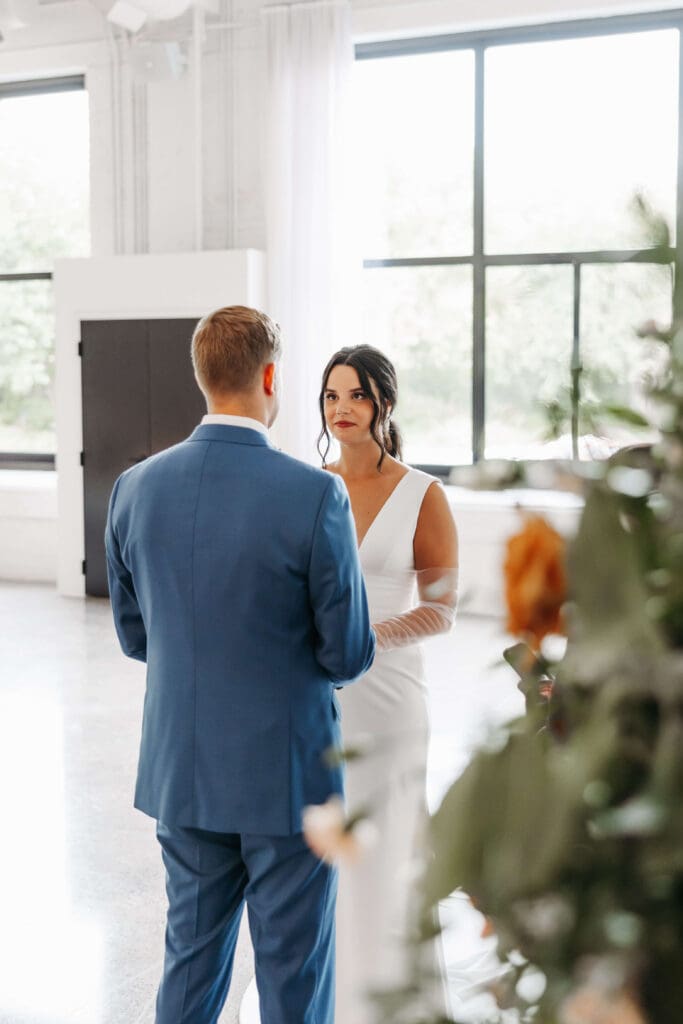 Bride and groom exchange intimate vows at Urban Daisy in Minneapolis