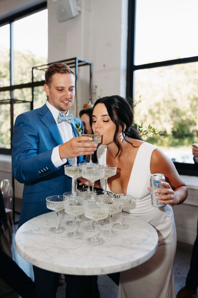 Bride sips from champagne tower in chic wedding downtown Minneapolis