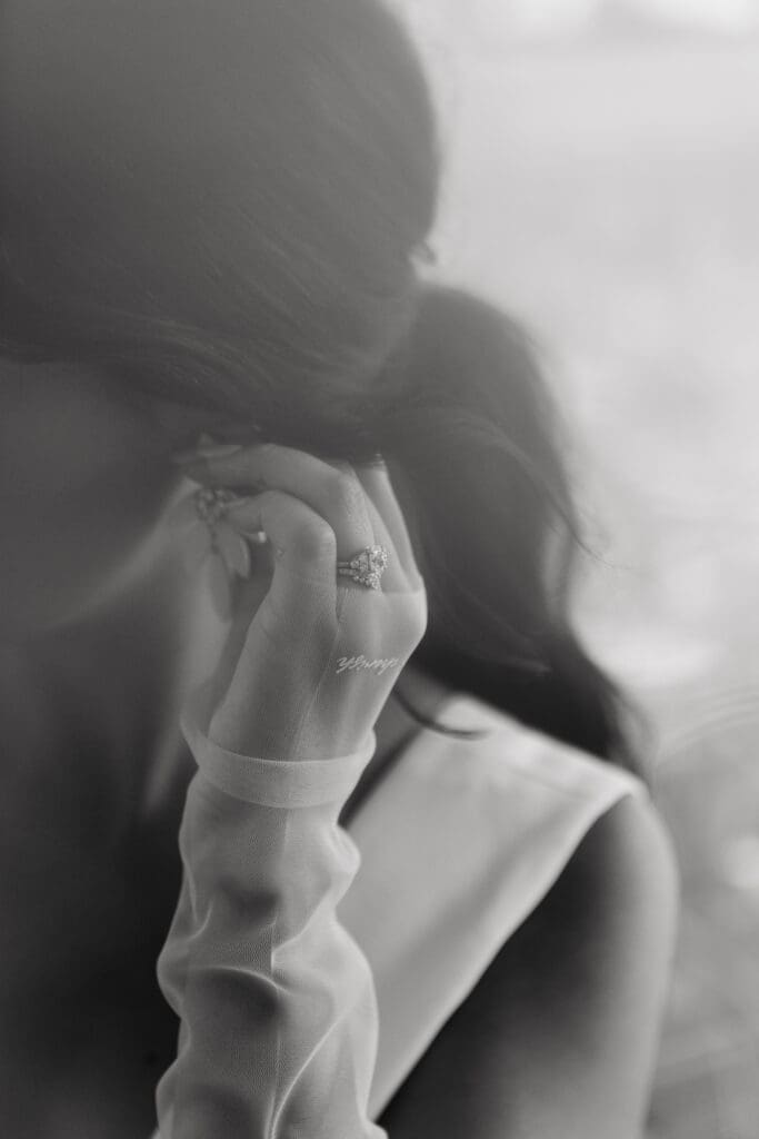 Bride puts earrings on