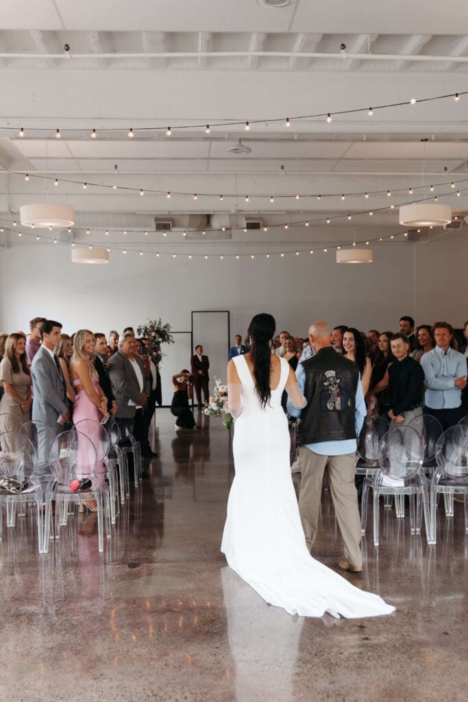 Bride walks up the aisle in intimate ceremony