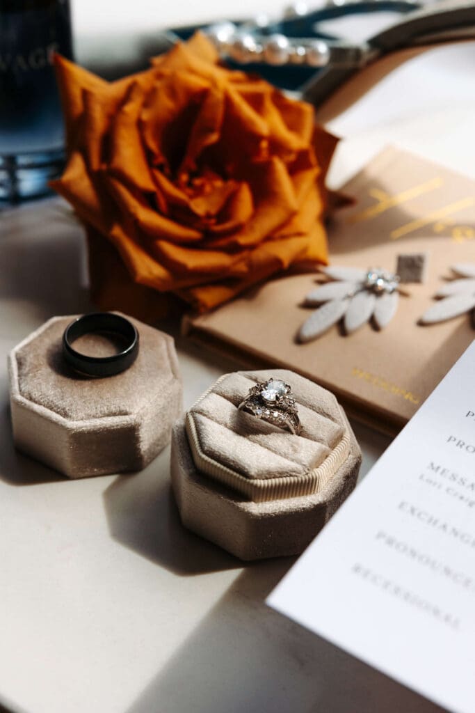 Rings and florals in wedding flat lay details