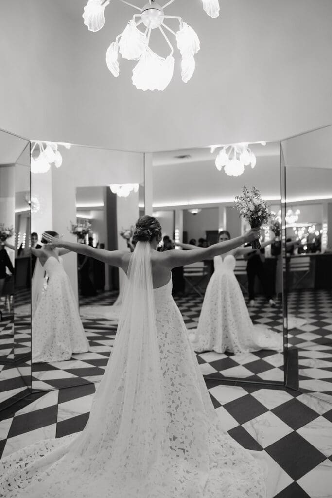 Bride admiring her wedding dress inside the modern bridal suite at Equestria West.
