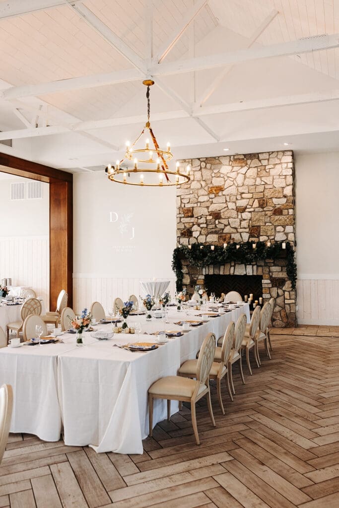 Elegant reception tables inside Equestria West, showcasing natural light, white architecture, and timeless wedding design.