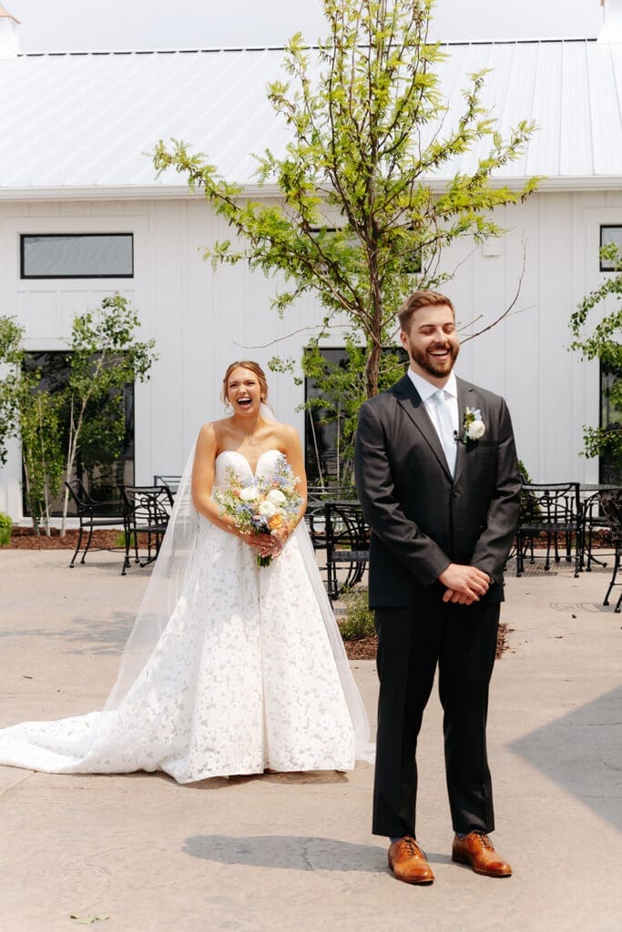 Bride surprises her groom during a joyful wedding first look before the ceremony at Equestria West in Minnesota.