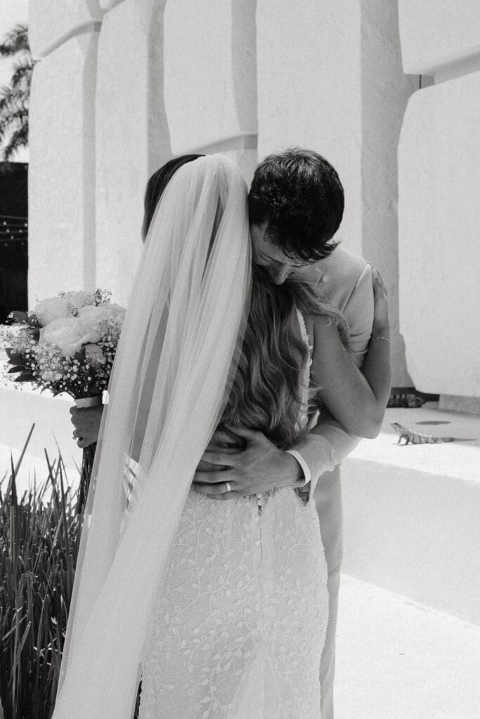 Newlyweds embrace after an unforgettable wedding first look at Grand Palladium Select Costa Mujeres , one of the many benefits of a first look before the ceremony.